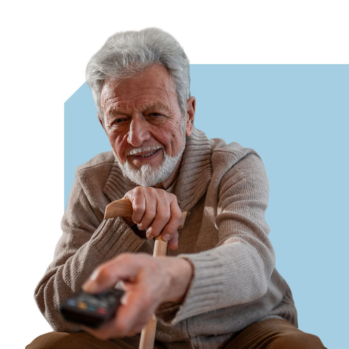 elderly man sitting alone watching the tv